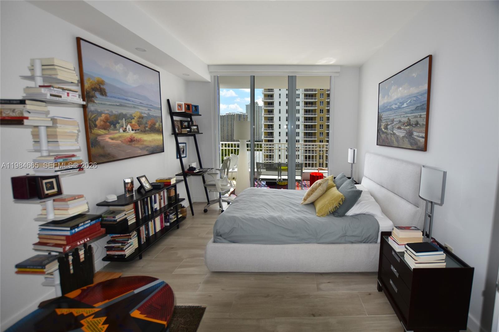 801 Brickell Key Boulevard, Unit 1209 Miami, FL 33131 - Photo 15 of 52 a living room with furniture a flat screen tv and a window