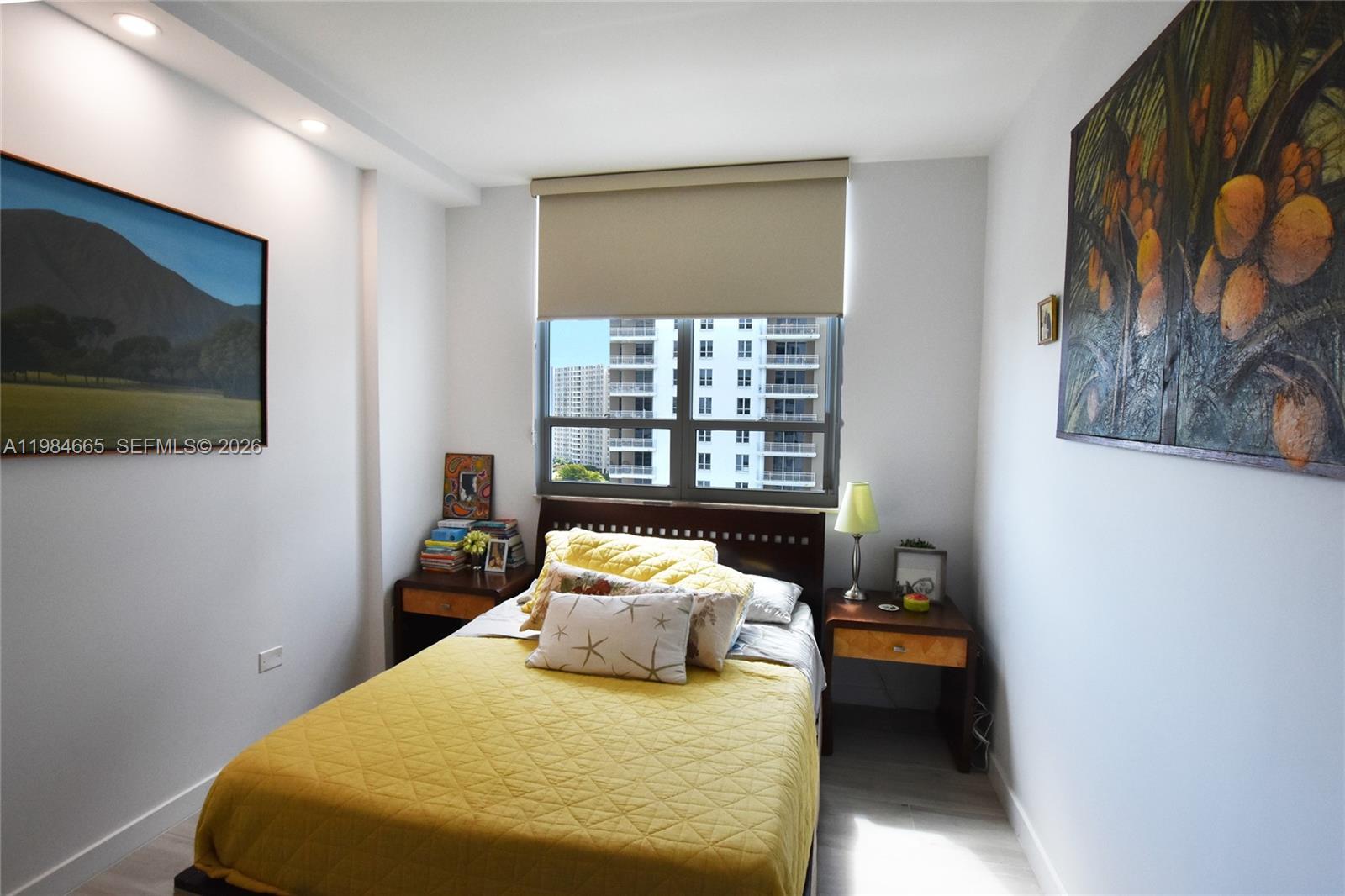 801 Brickell Key Boulevard, Unit 1209 Miami, FL 33131 - Photo 23 of 52 a bedroom with a bed and a flat screen tv