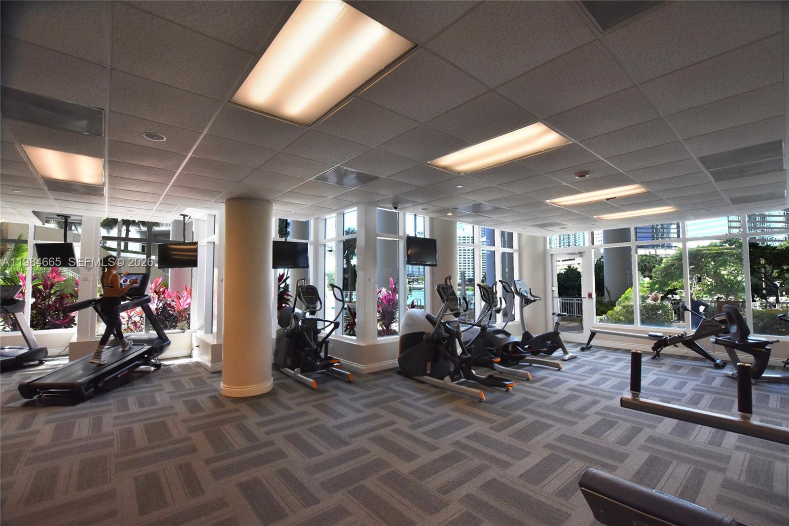 801 Brickell Key Boulevard, Unit 1209 Miami, FL 33131 - Photo 30 of 52 a view of a room with gym equipment