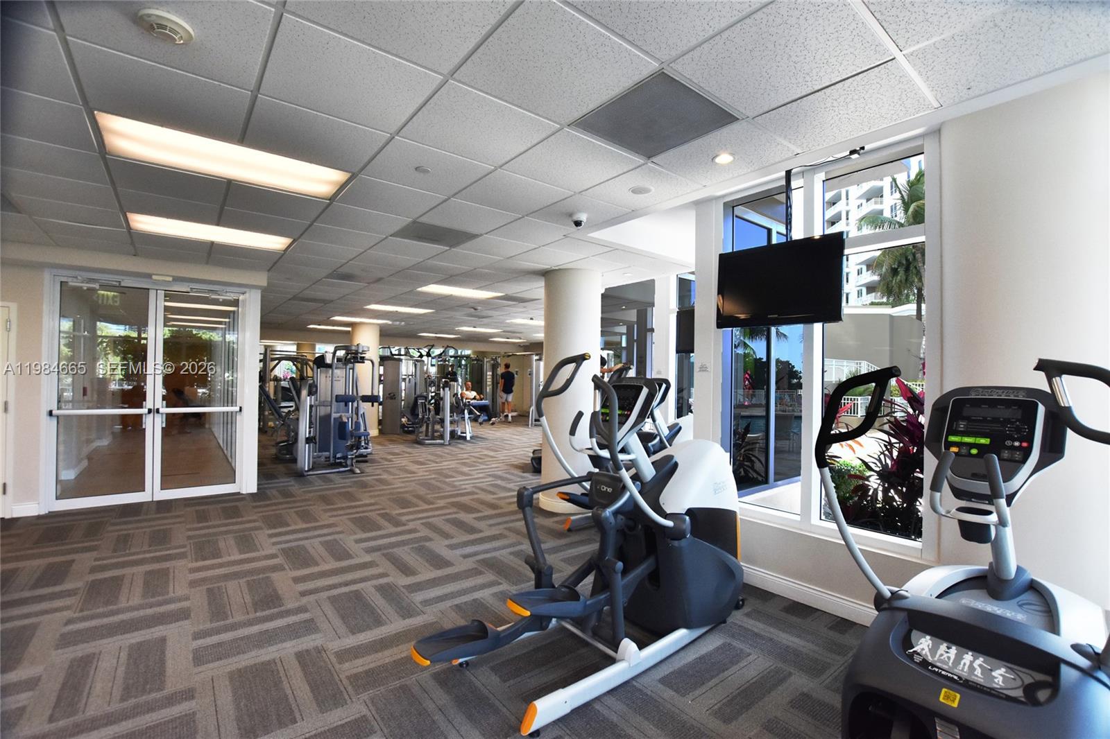 801 Brickell Key Boulevard, Unit 1209 Miami, FL 33131 - Photo 33 of 52 a view of a room with gym equipment