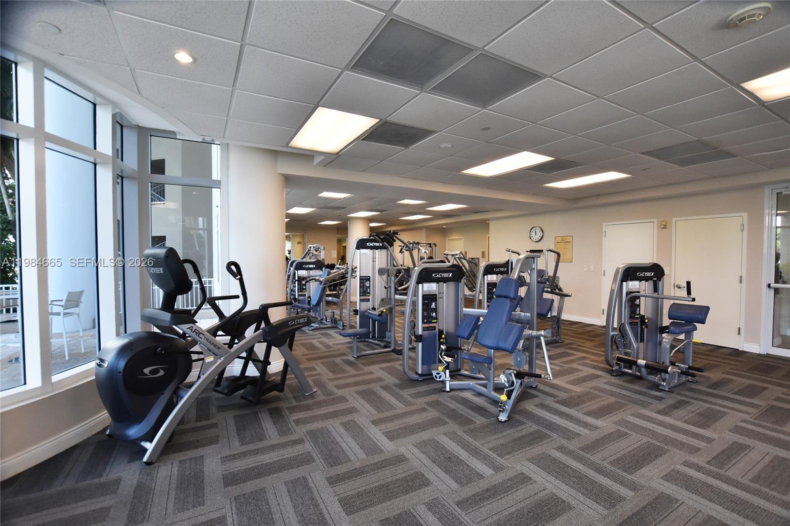 801 Brickell Key Boulevard, Unit 1209 Miami, FL 33131 - Photo 34 of 52 a view of a room with gym equipment