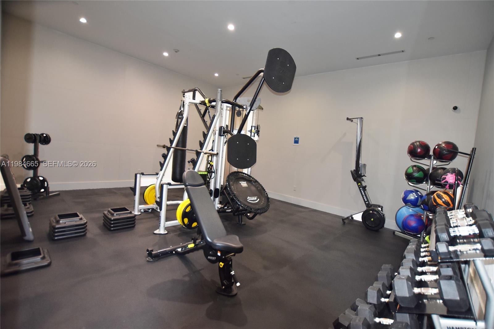 801 Brickell Key Boulevard, Unit 1209 Miami, FL 33131 - Photo 35 of 52 a view of a room with gym equipment