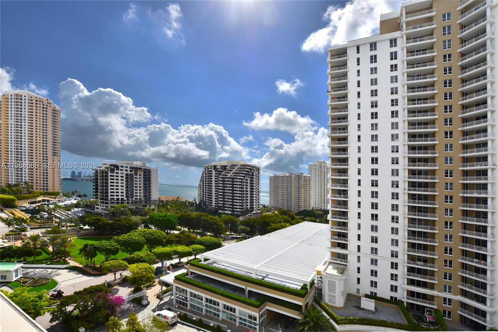 801 Brickell Key Boulevard, Unit 1209 Miami, FL 33131 - Photo 4 of 52 a view of a balcony with chairs