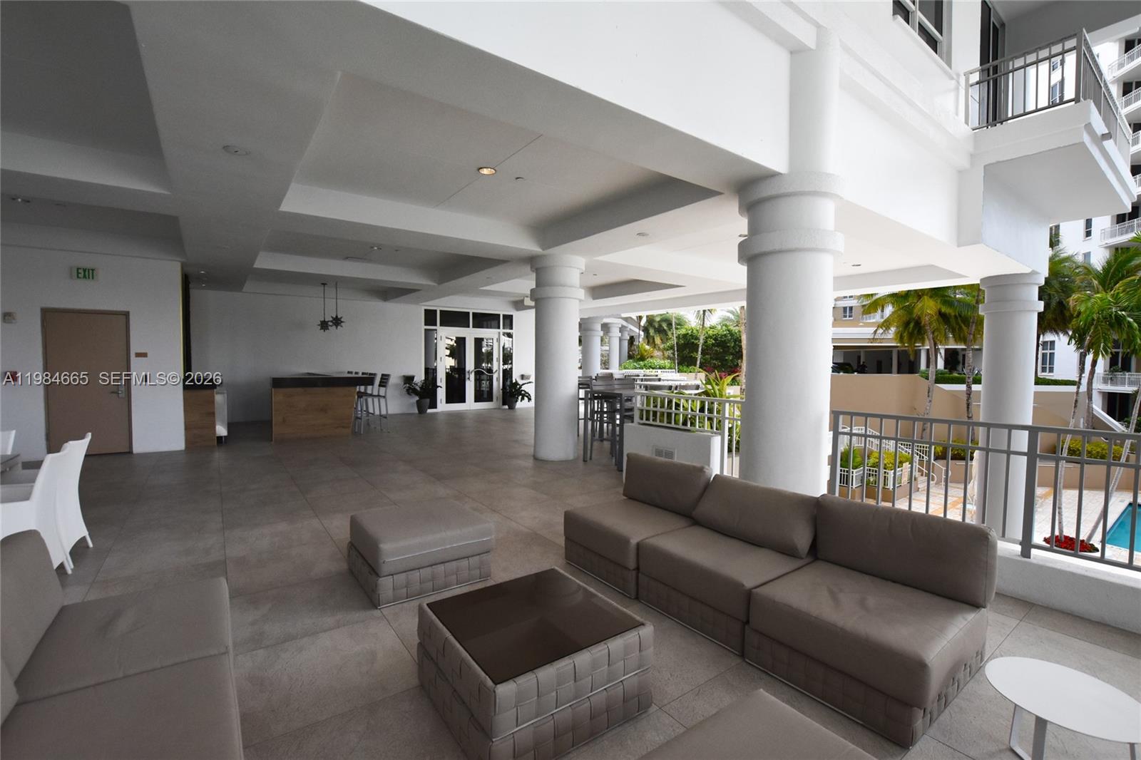 801 Brickell Key Boulevard, Unit 1209 Miami, FL 33131 - Photo 46 of 52 a living room with furniture and a large window