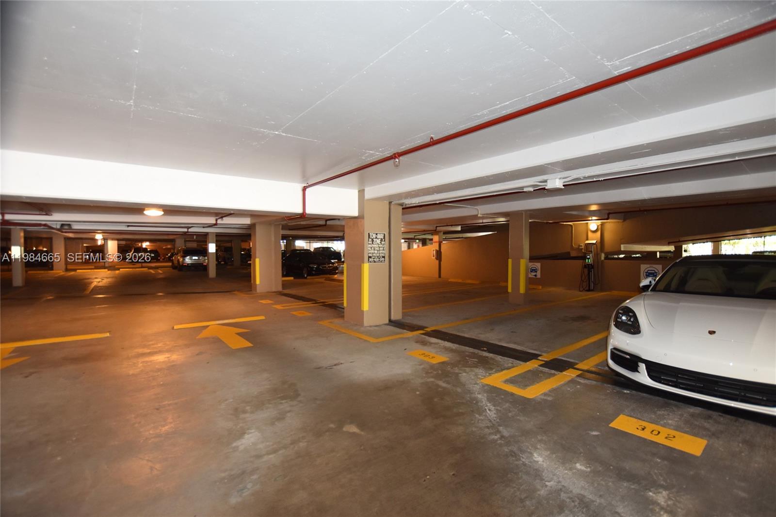 801 Brickell Key Boulevard, Unit 1209 Miami, FL 33131 - Photo 52 of 52 a car parked in parking area