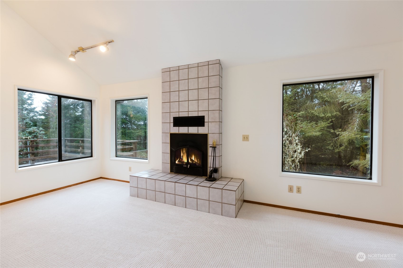 198 Ridgedale Road Friday Harbor, WA 98250 - Photo 14 of 39 a living room with furniture and a fireplace