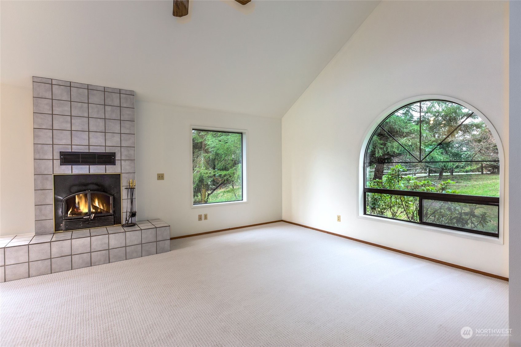 198 Ridgedale Road Friday Harbor, WA 98250 - Photo 15 of 39 an empty room with windows and fireplace