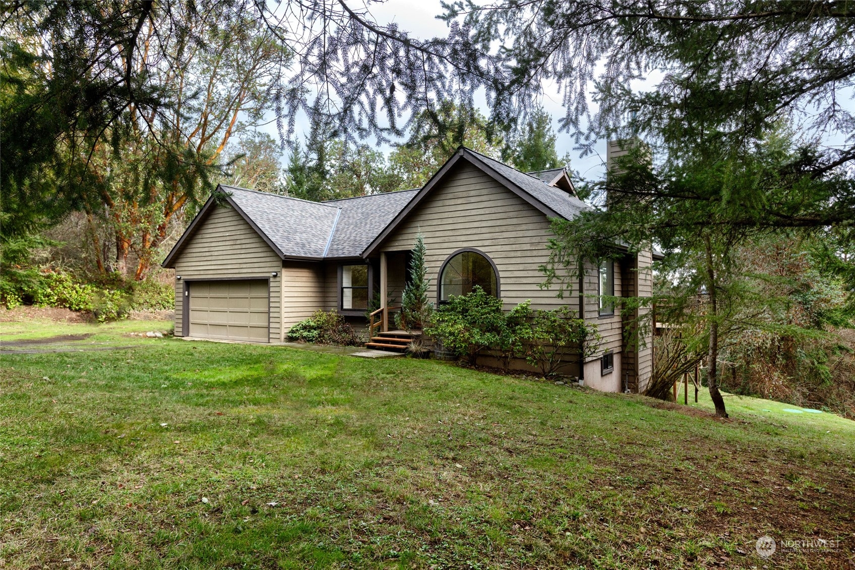 198 Ridgedale Road Friday Harbor, WA 98250 - Photo 18 of 39 a view of a house with backyard and garden