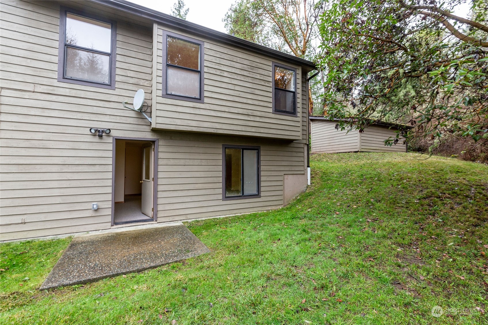 198 Ridgedale Road Friday Harbor, WA 98250 - Photo 32 of 39 a front view of a house with a yard and garage