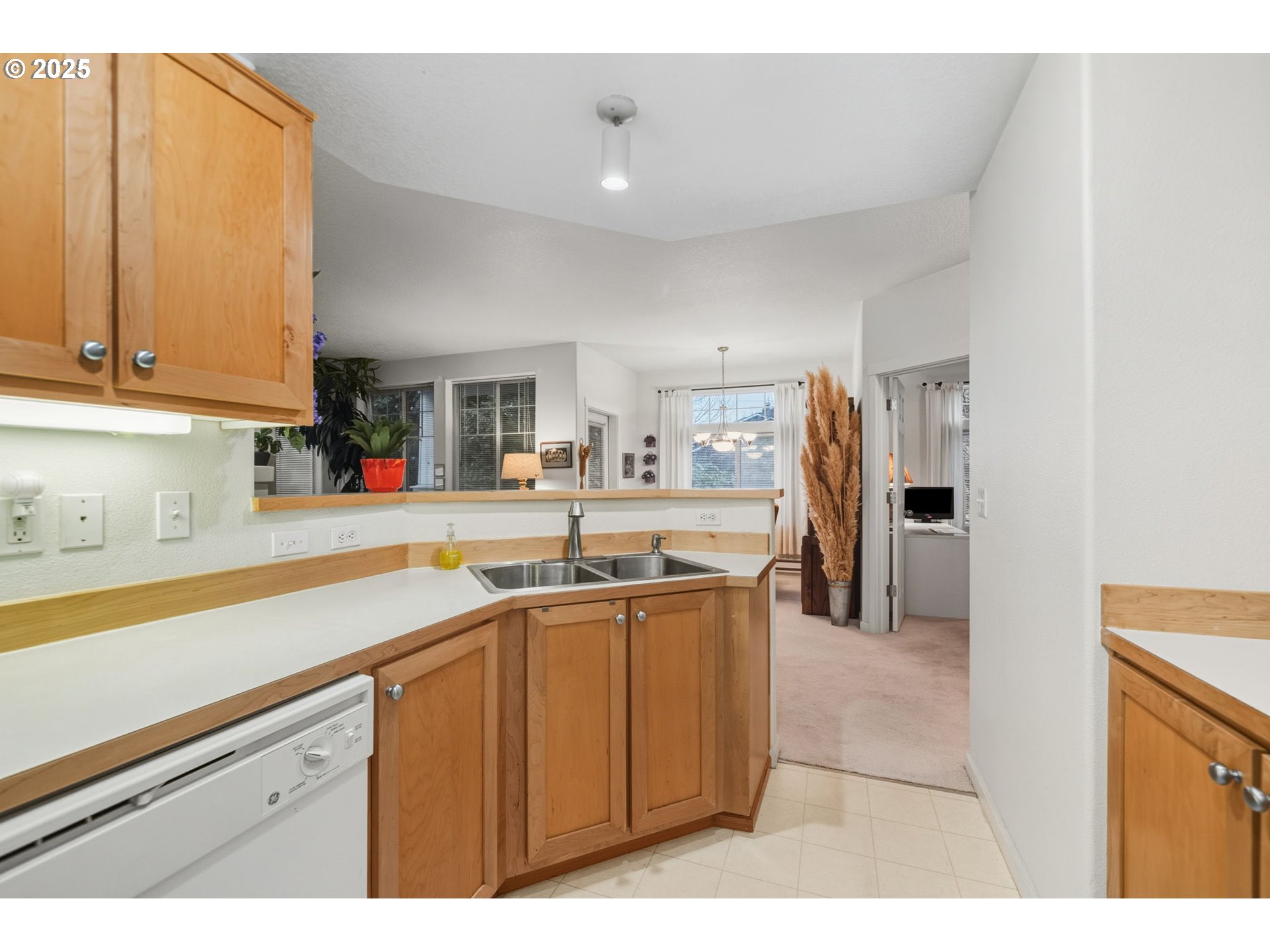 14615 Southwest Beard Road, Unit 101 Beaverton, OR 97007 - Photo 12 of 28 a kitchen with a sink and cabinets