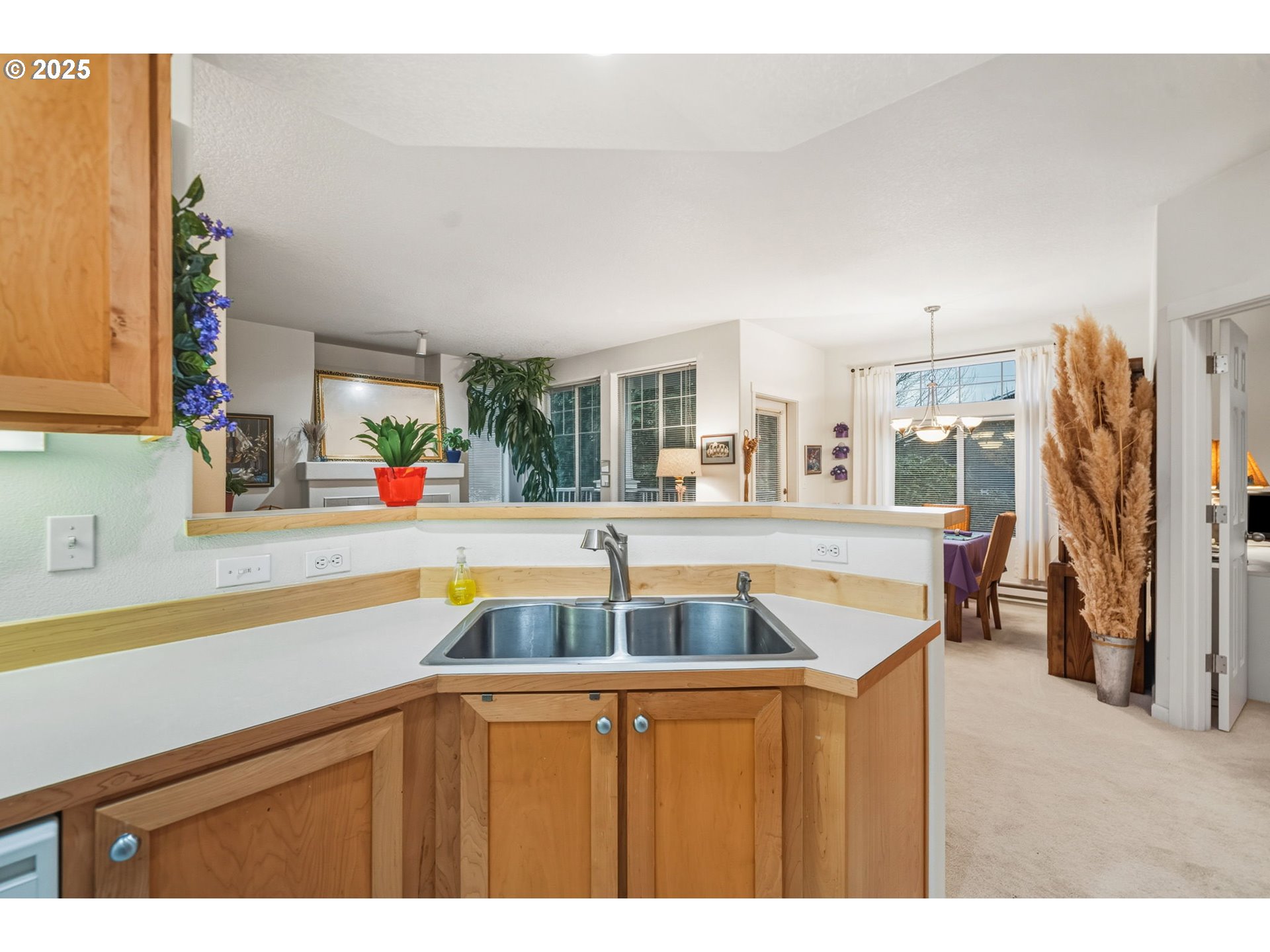 14615 Southwest Beard Road, Unit 101 Beaverton, OR 97007 - Photo 13 of 28 a kitchen with a sink and a wooden floor