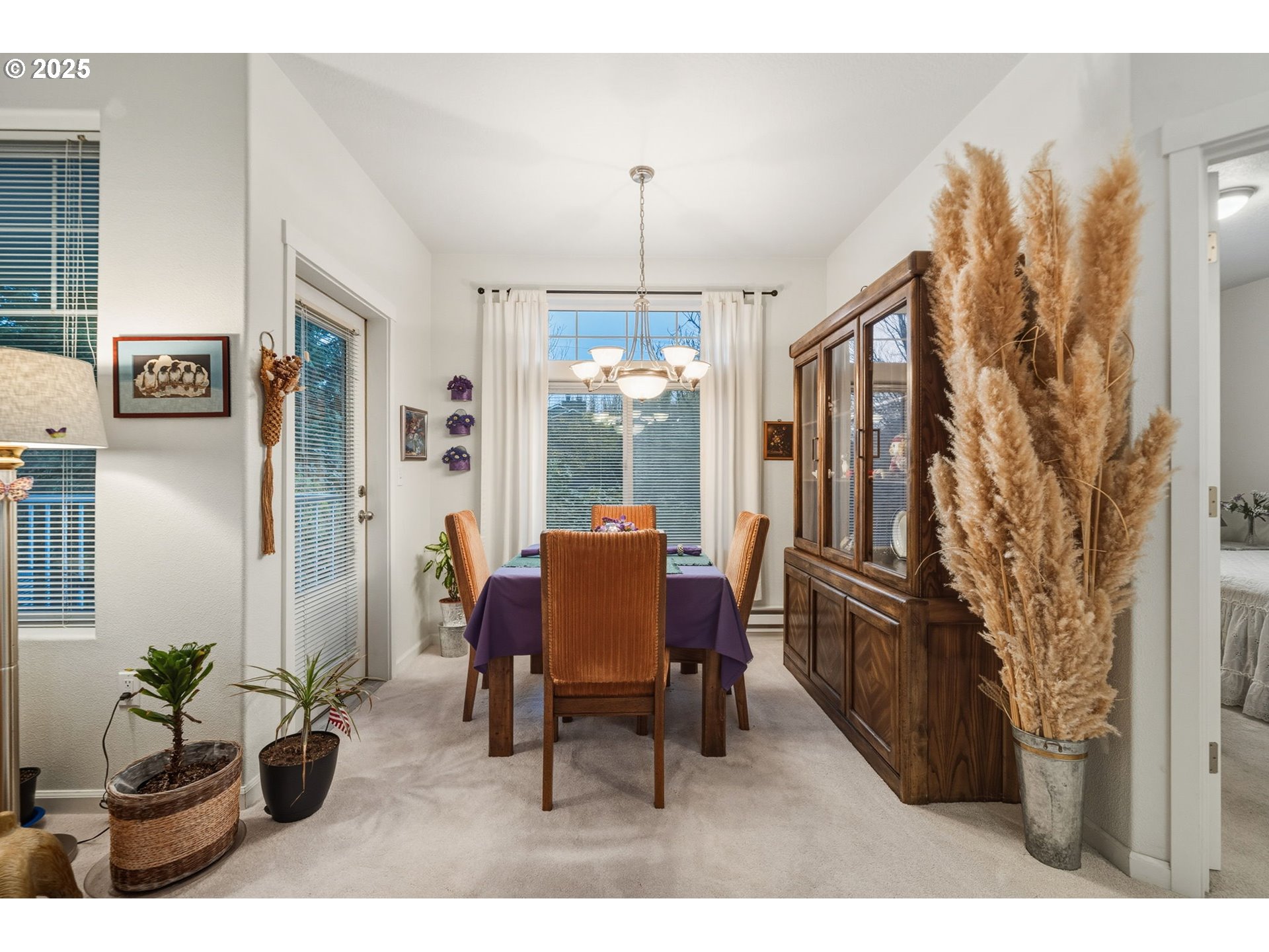 14615 Southwest Beard Road, Unit 101 Beaverton, OR 97007 - Photo 14 of 28 a living room with furniture and a chandelier