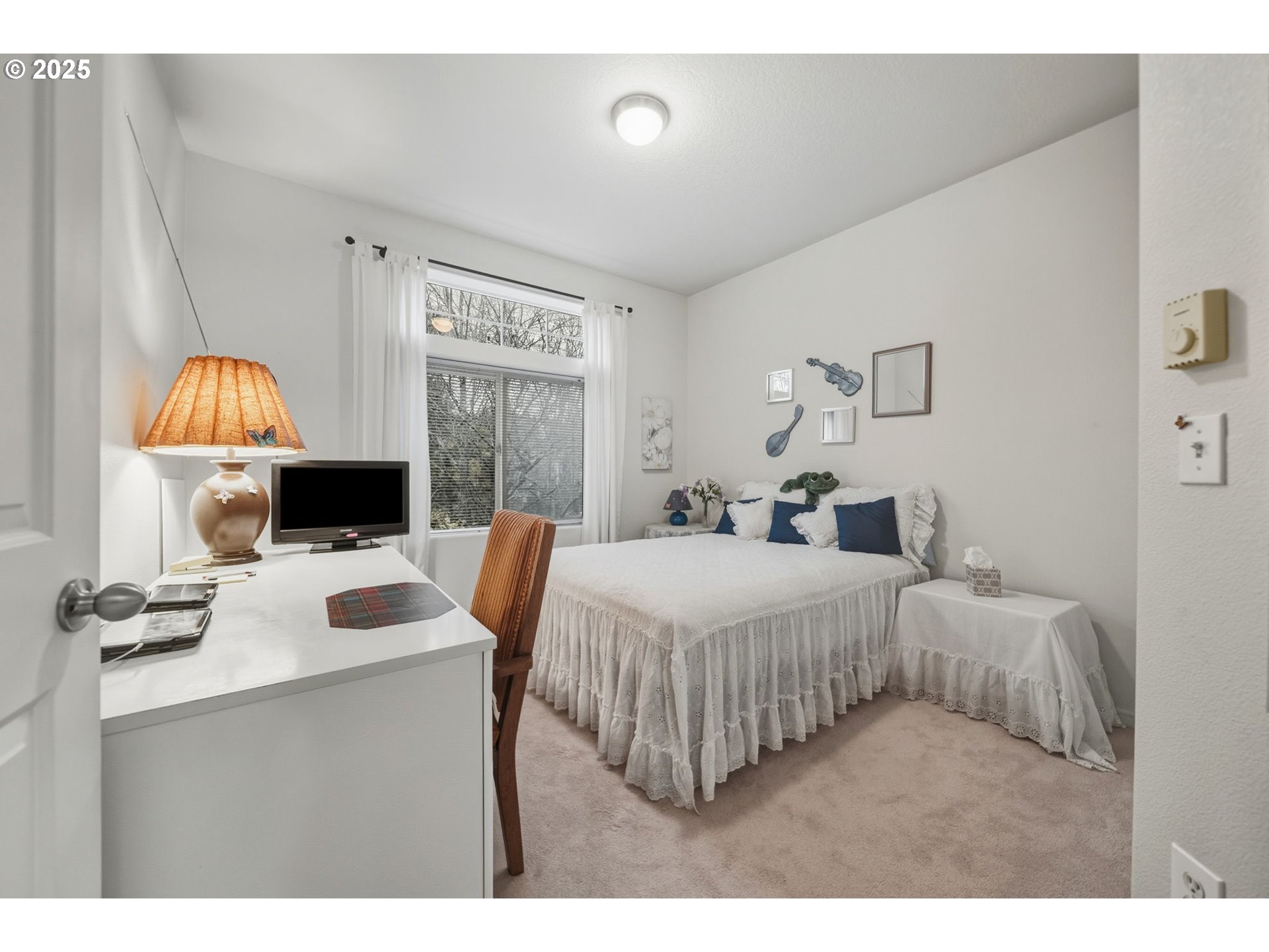 14615 Southwest Beard Road, Unit 101 Beaverton, OR 97007 - Photo 17 of 28 a bedroom with a bed and a table