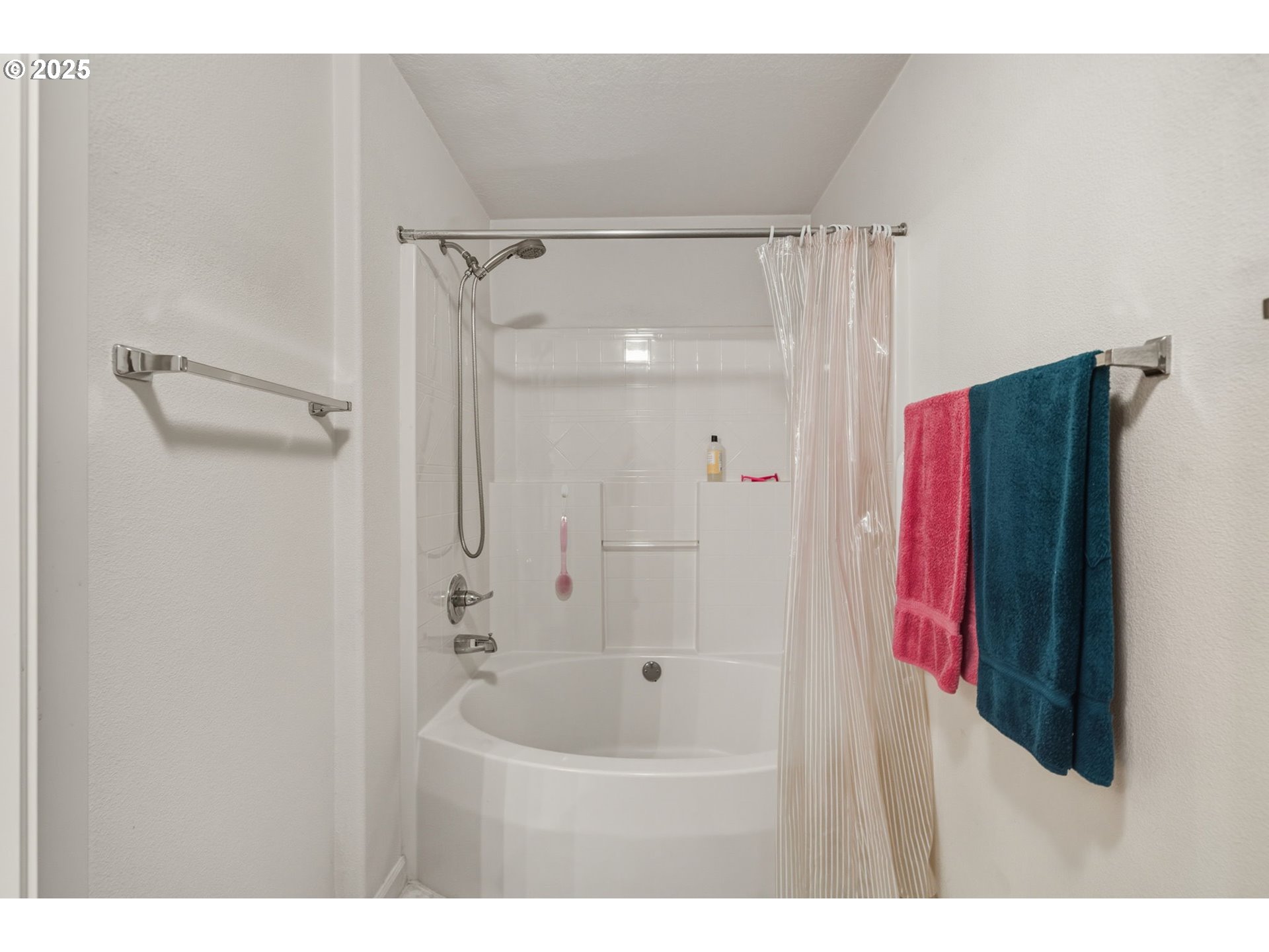 14615 Southwest Beard Road, Unit 101 Beaverton, OR 97007 - Photo 24 of 28 a bathroom with a bathtub and a shower