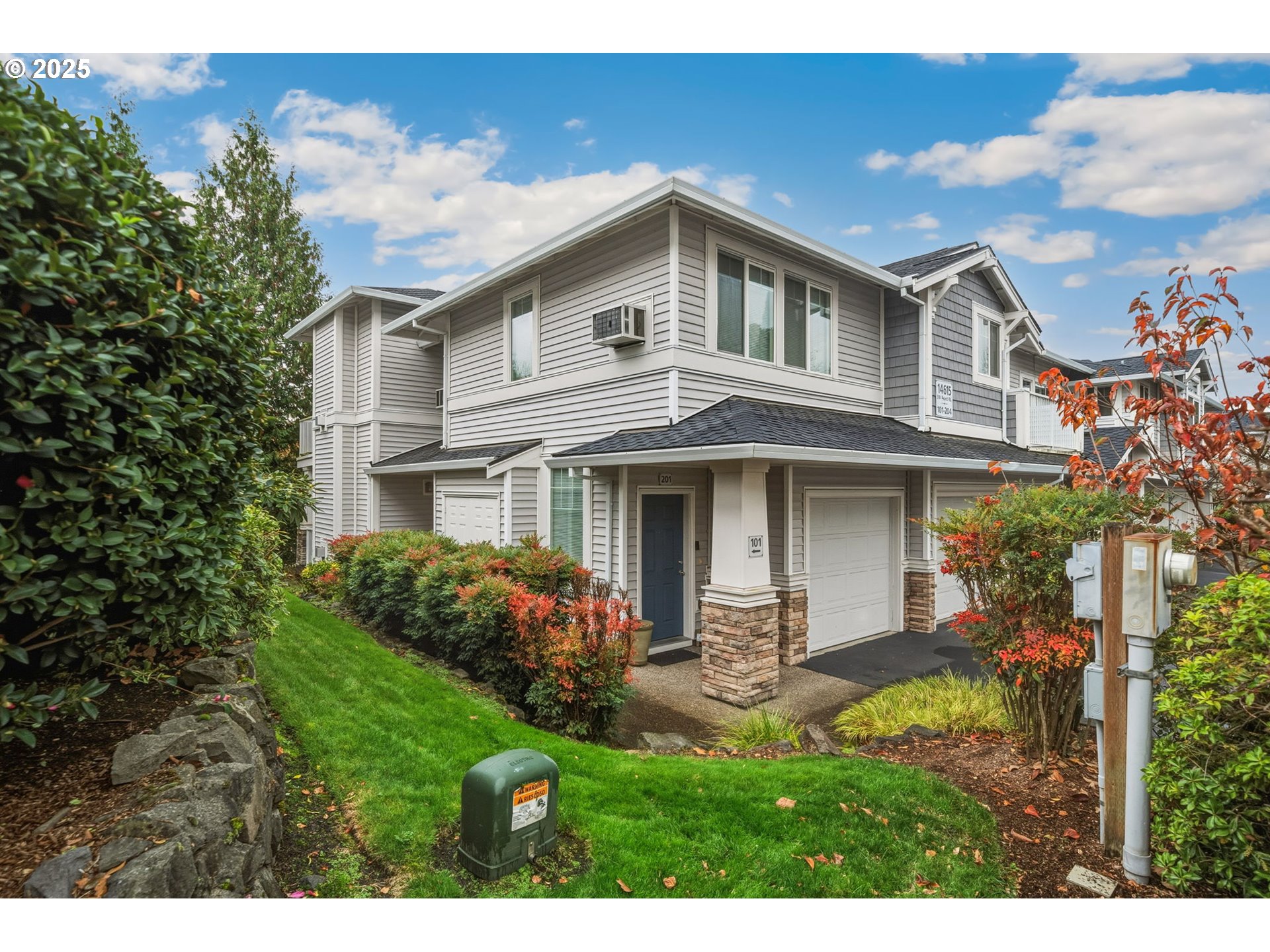 14615 Southwest Beard Road, Unit 101 Beaverton, OR 97007 - Photo 3 of 28 a front view of a house with a yard