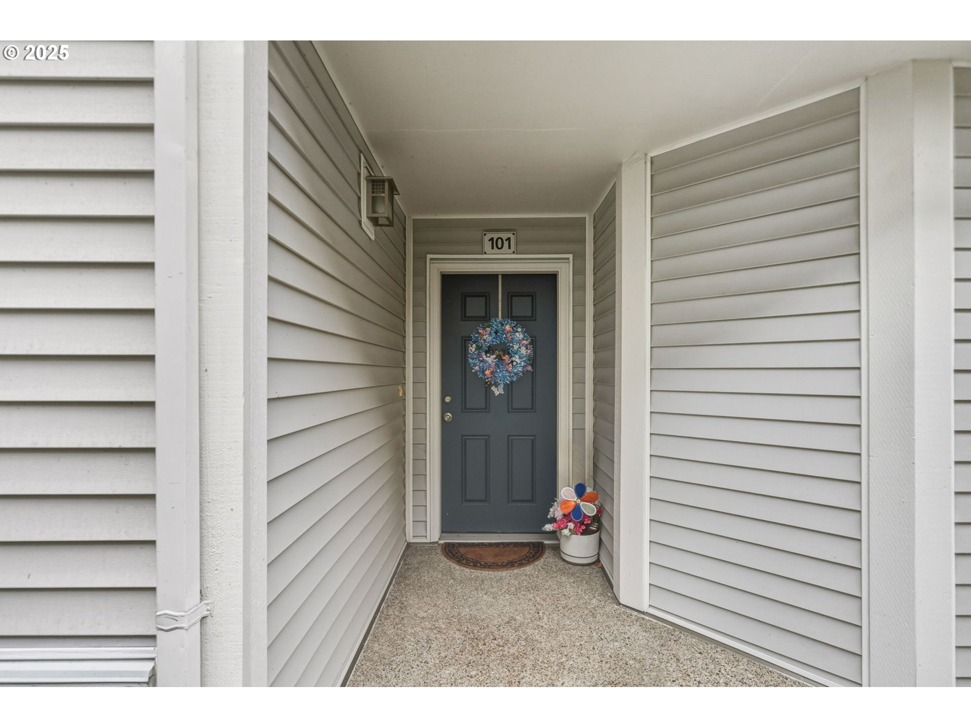 14615 Southwest Beard Road, Unit 101 Beaverton, OR 97007 - Photo 4 of 28 a view of a house with a white door