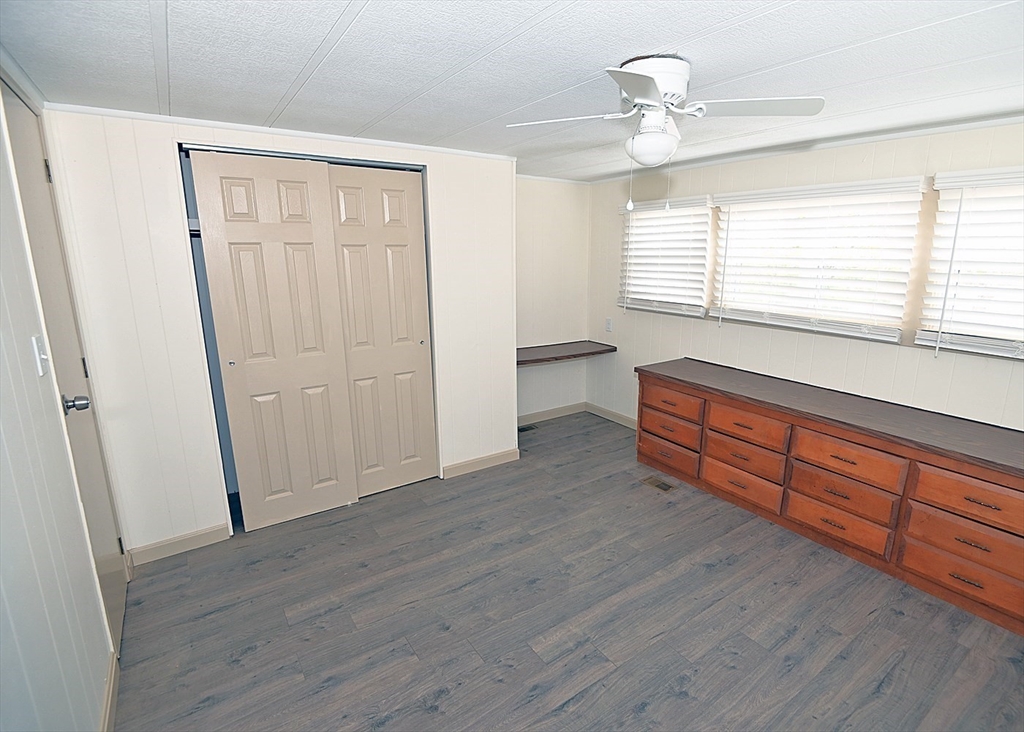 44 Clems Way Acushnet, MA 02743 - Photo 11 of 18 an empty room with wooden floor and windows