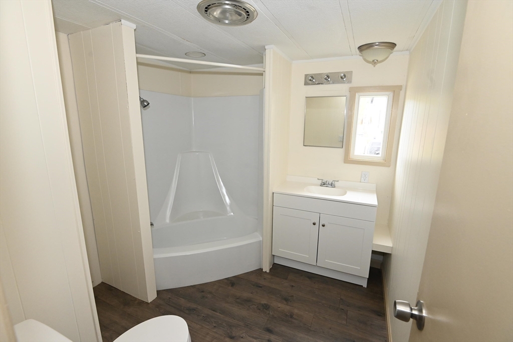 44 Clems Way Acushnet, MA 02743 - Photo 12 of 18 a bathroom with a sink a toilet and shower