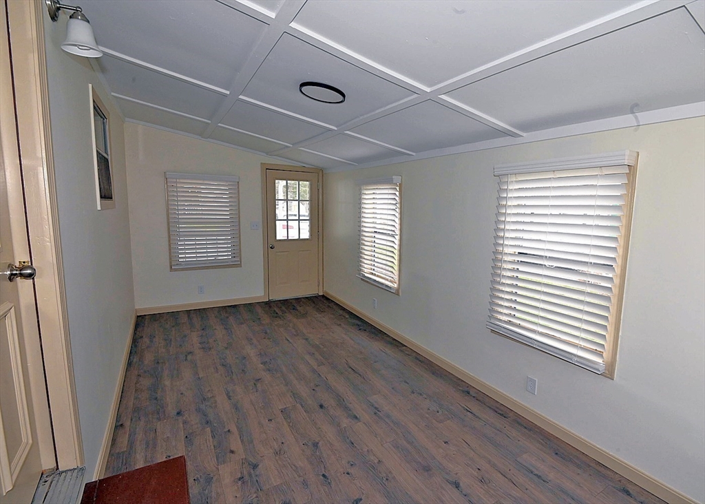 44 Clems Way Acushnet, MA 02743 - Photo 18 of 18 a view of an empty room with wooden floor and a window