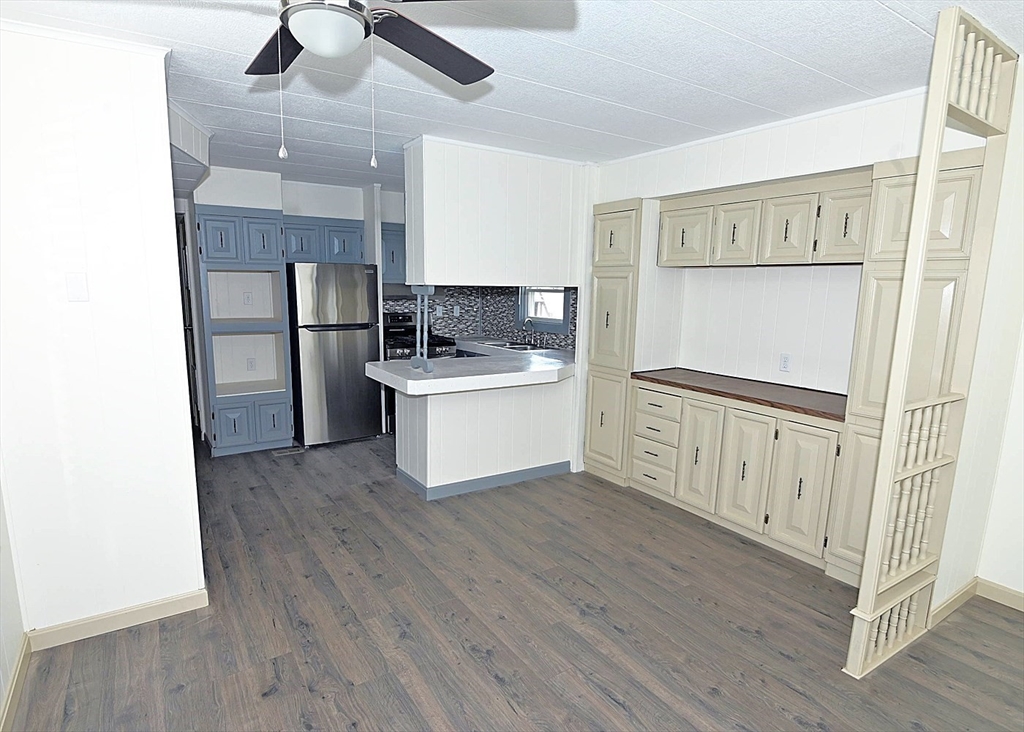 44 Clems Way Acushnet, MA 02743 - Photo 7 of 18 a kitchen with stainless steel appliances a refrigerator and a hard wood floor