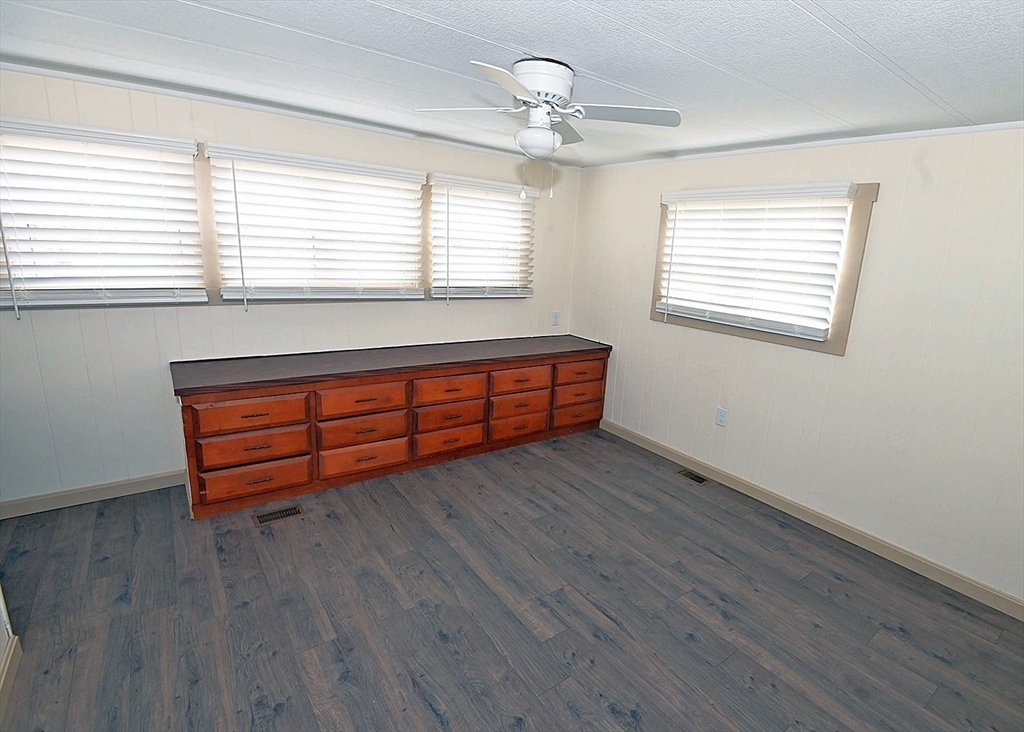 44 Clems Way Acushnet, MA 02743 - Photo 9 of 18 a view of a room with wooden floors and a window