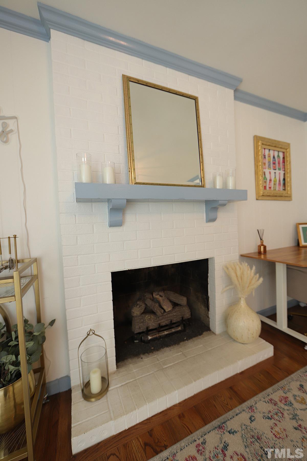 3404 Blue Ridge Road Raleigh, NC 27612 - Photo 17 of 36 a living room with furniture and a fireplace