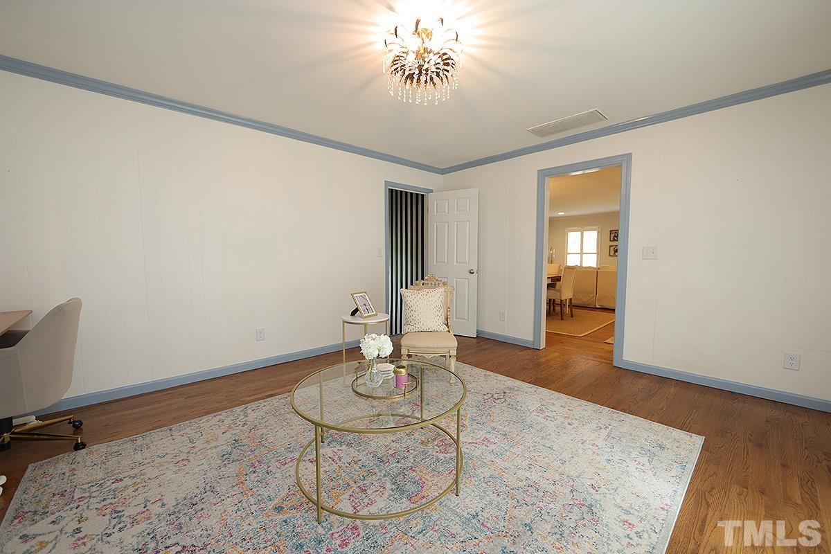 3404 Blue Ridge Road Raleigh, NC 27612 - Photo 18 of 36 a living room with furniture and wooden floor