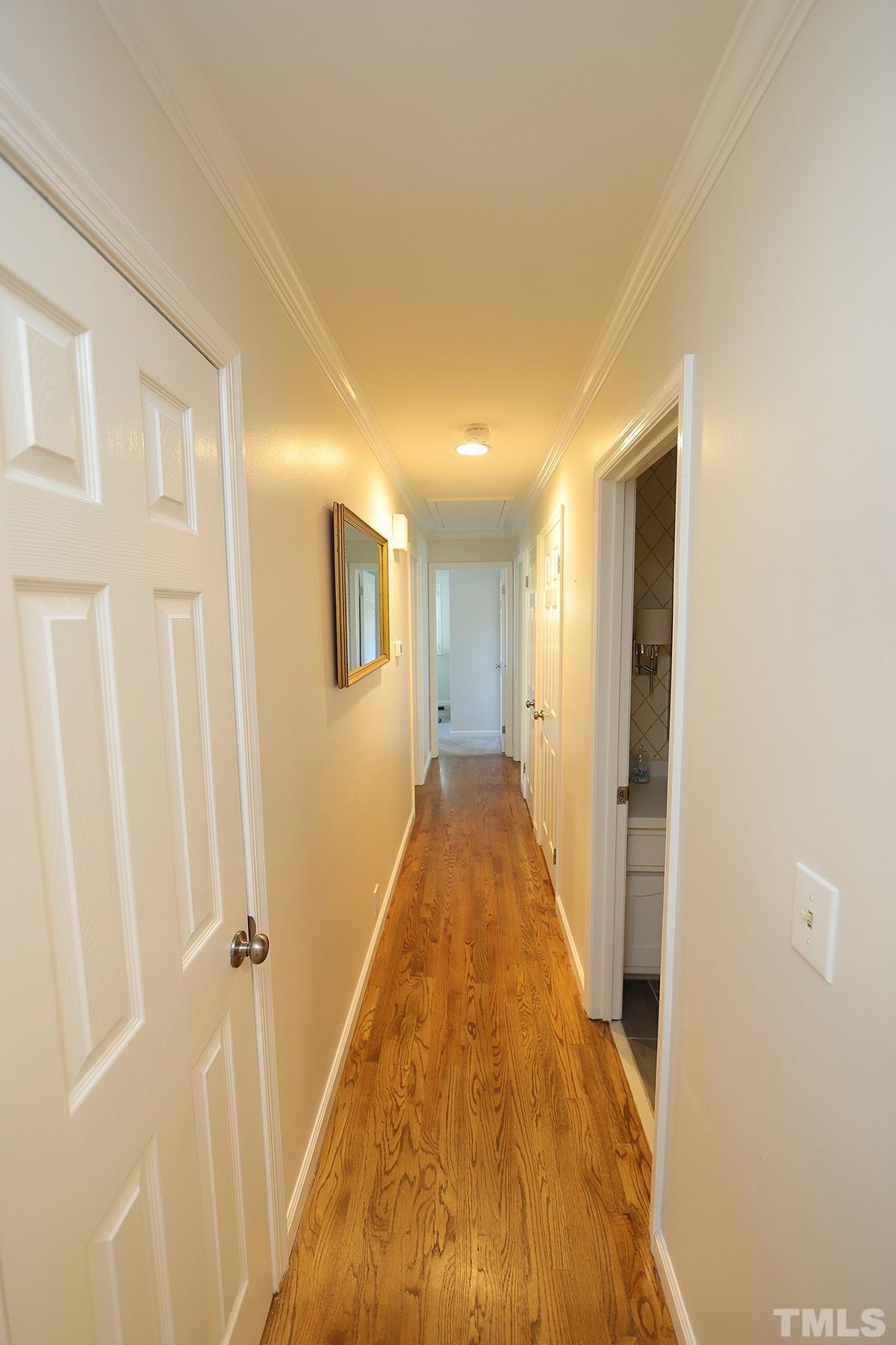 3404 Blue Ridge Road Raleigh, NC 27612 - Photo 22 of 36 a view of a hallway with wooden floor and closet