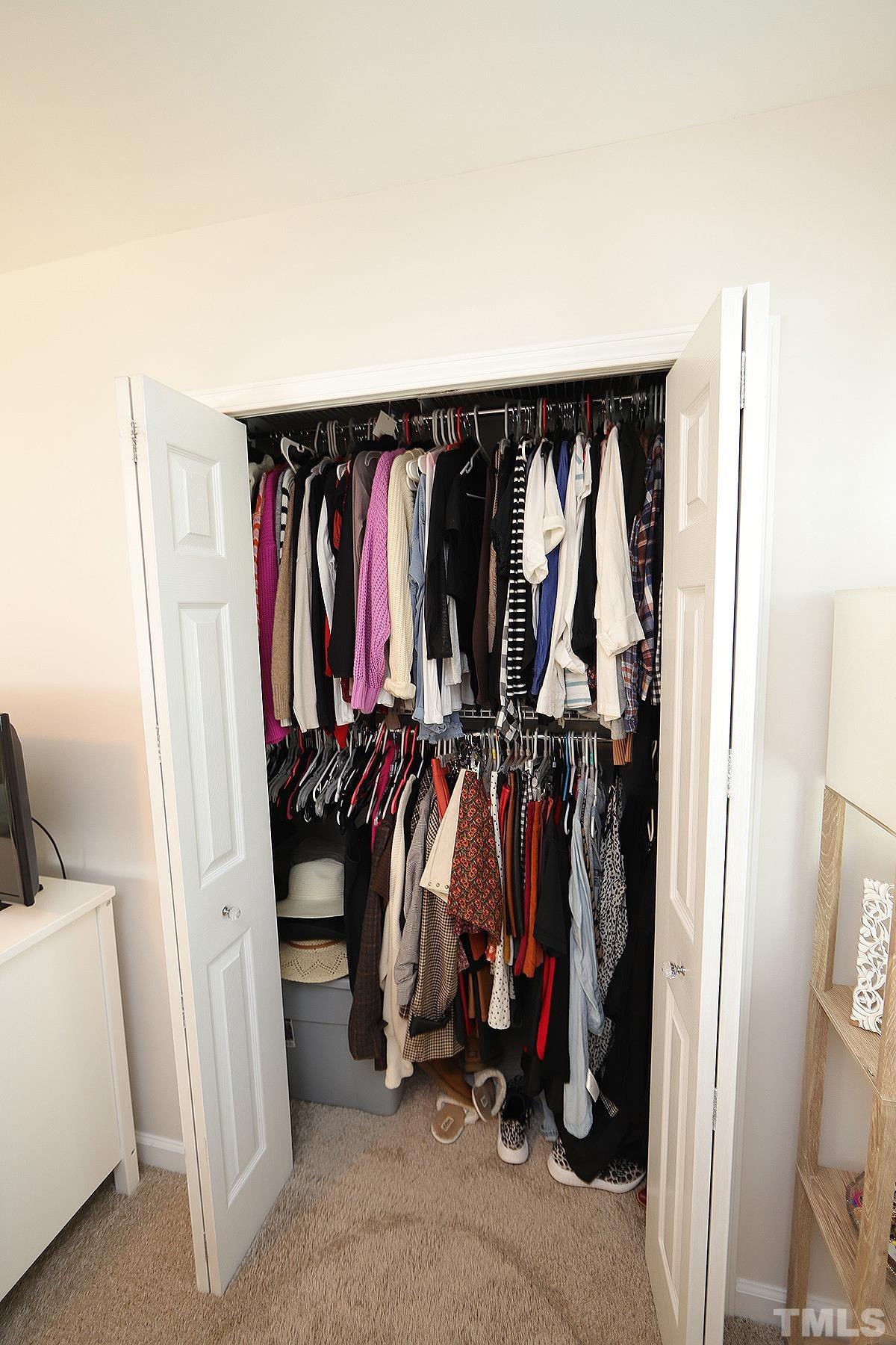 3404 Blue Ridge Road Raleigh, NC 27612 - Photo 26 of 36 a view of walk in closet with clothes