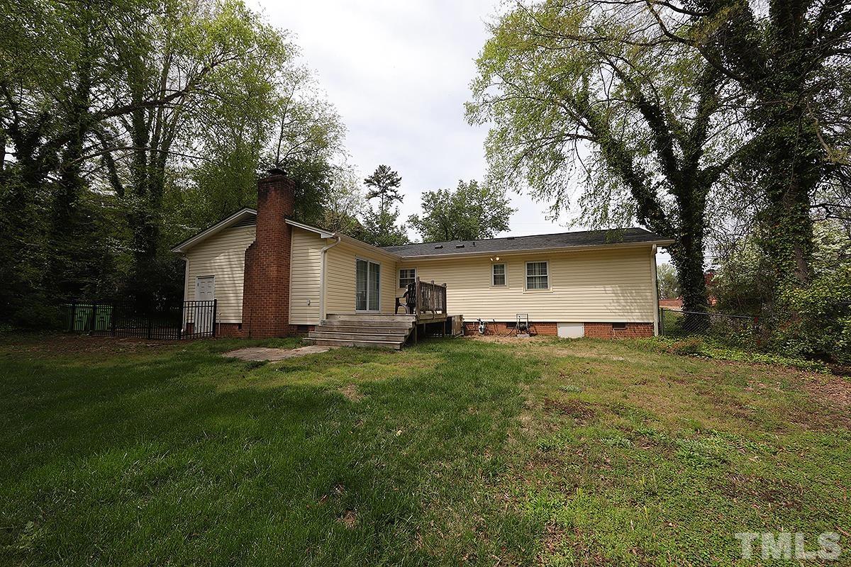 3404 Blue Ridge Road Raleigh, NC 27612 - Photo 33 of 36 a view of a backyard with a garden and trees