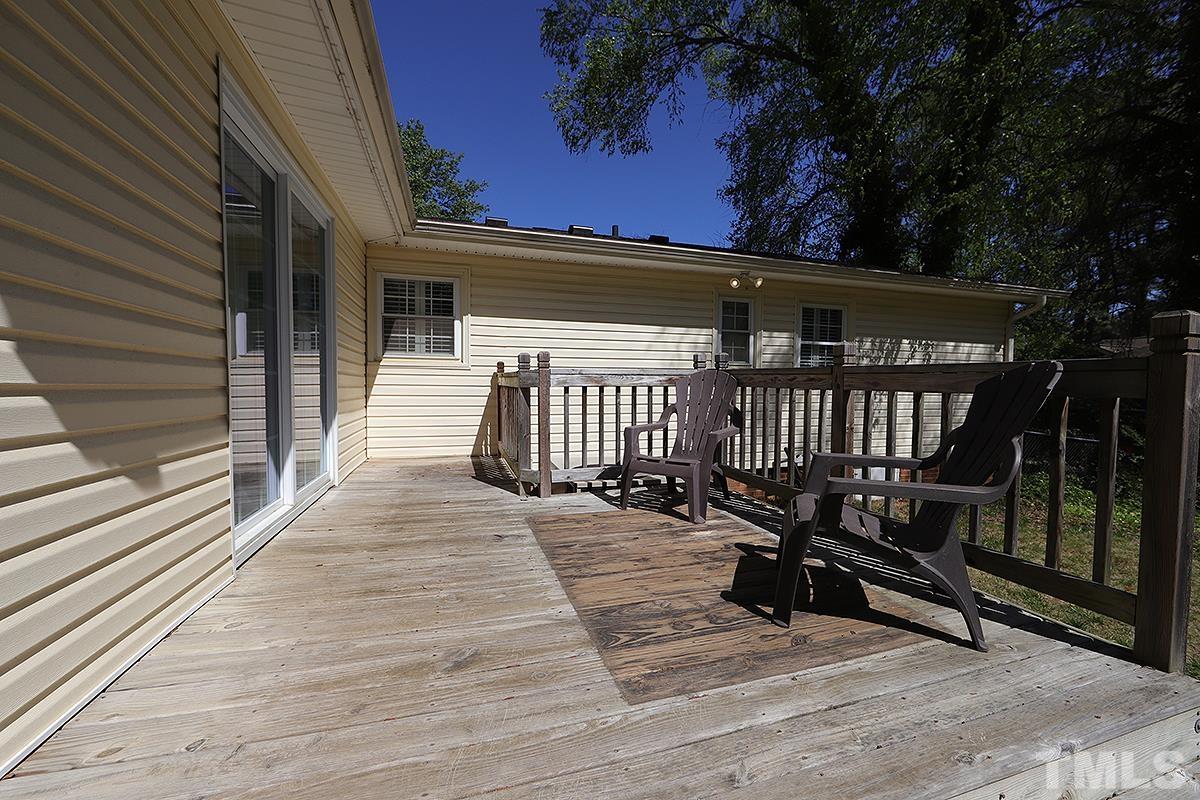 3404 Blue Ridge Road Raleigh, NC 27612 - Photo 35 of 36 a view of a deck with wooden floor and fence