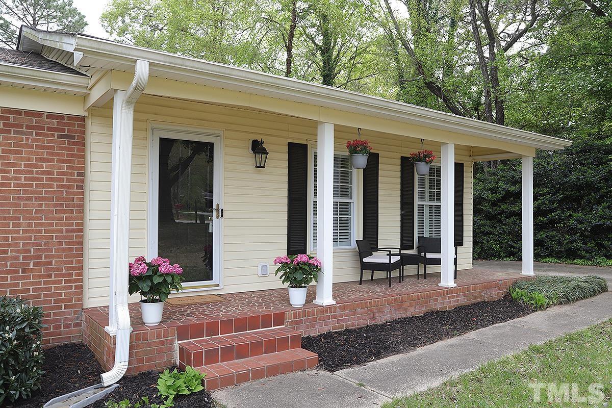 3404 Blue Ridge Road Raleigh, NC 27612 - Photo 4 of 36 a front view of house with yard