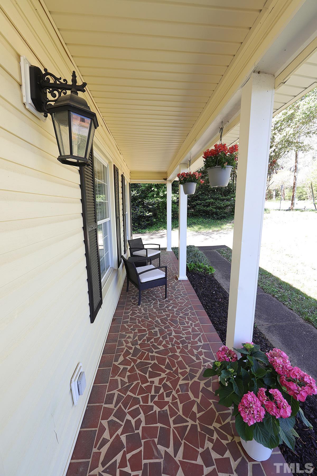 3404 Blue Ridge Road Raleigh, NC 27612 - Photo 5 of 36 a view of a porch with furniture