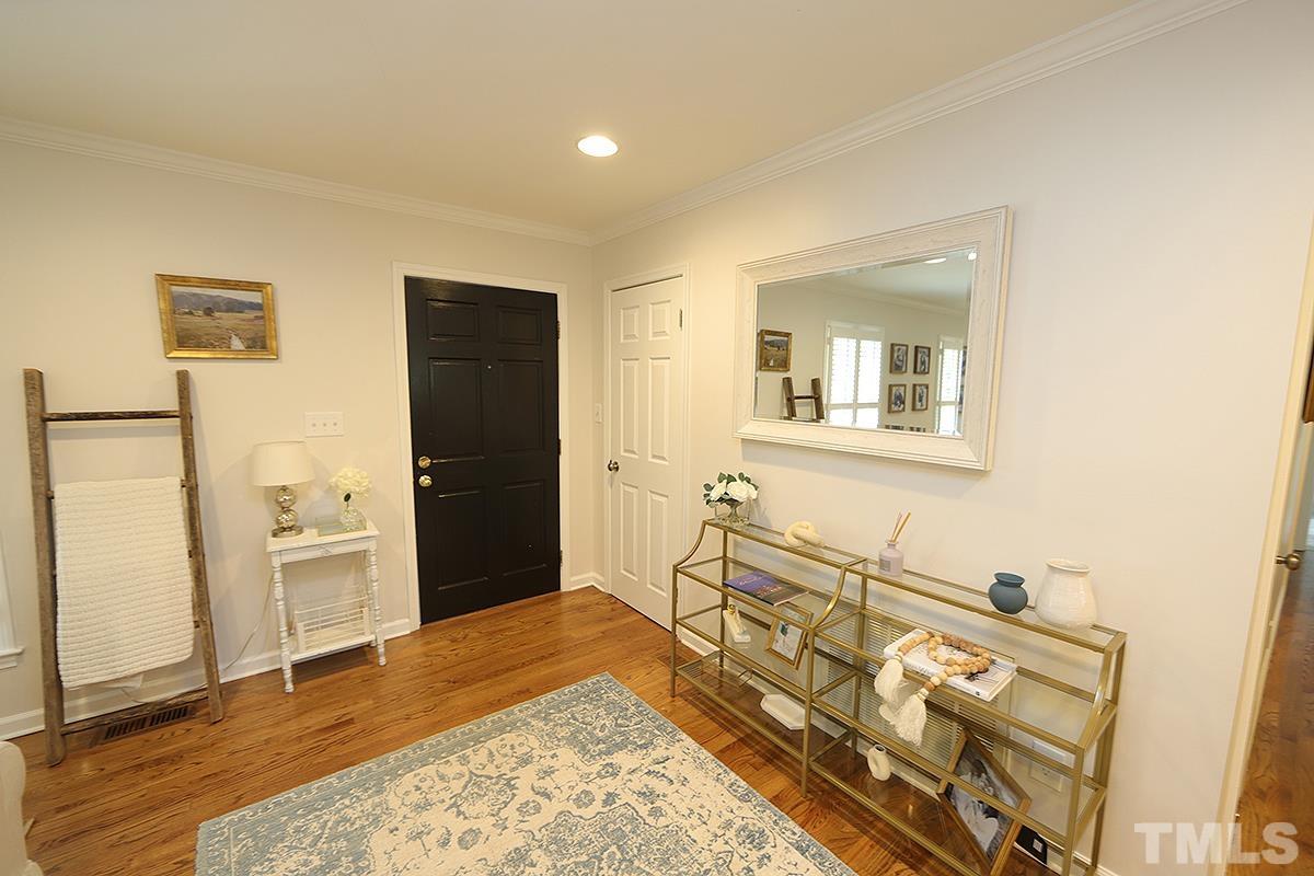 3404 Blue Ridge Road Raleigh, NC 27612 - Photo 36 of 36 a spacious bedroom with a bed and a dresser