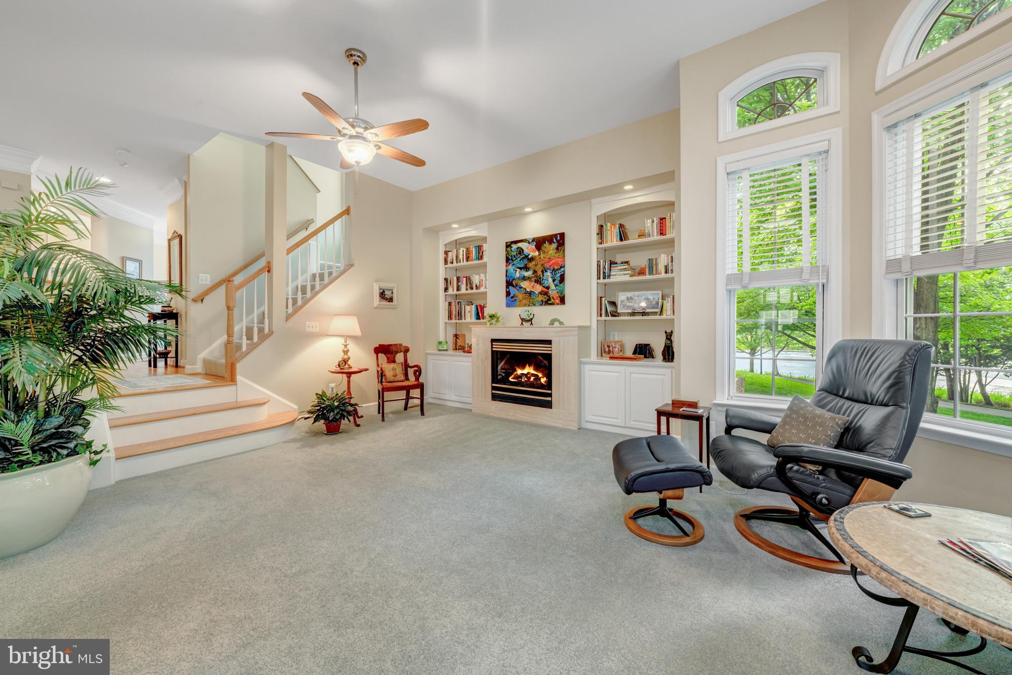 1925 Logan Manor Drive Reston, VA 20190 - Photo 7 of 61 a living room with furniture and a fireplace