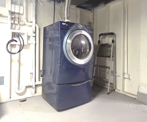 a view of a storage & utility room with a sink