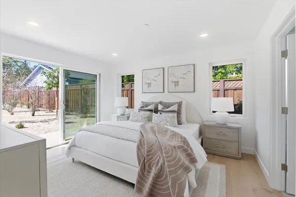 a bedroom with a bed and a desk