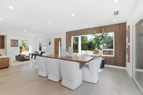 a kitchen with stainless steel appliances kitchen island granite countertop a stove a sink and a microwave