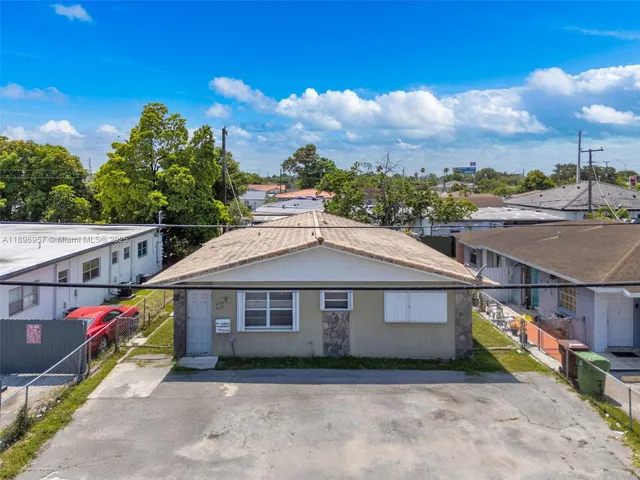 a house with trees in the background