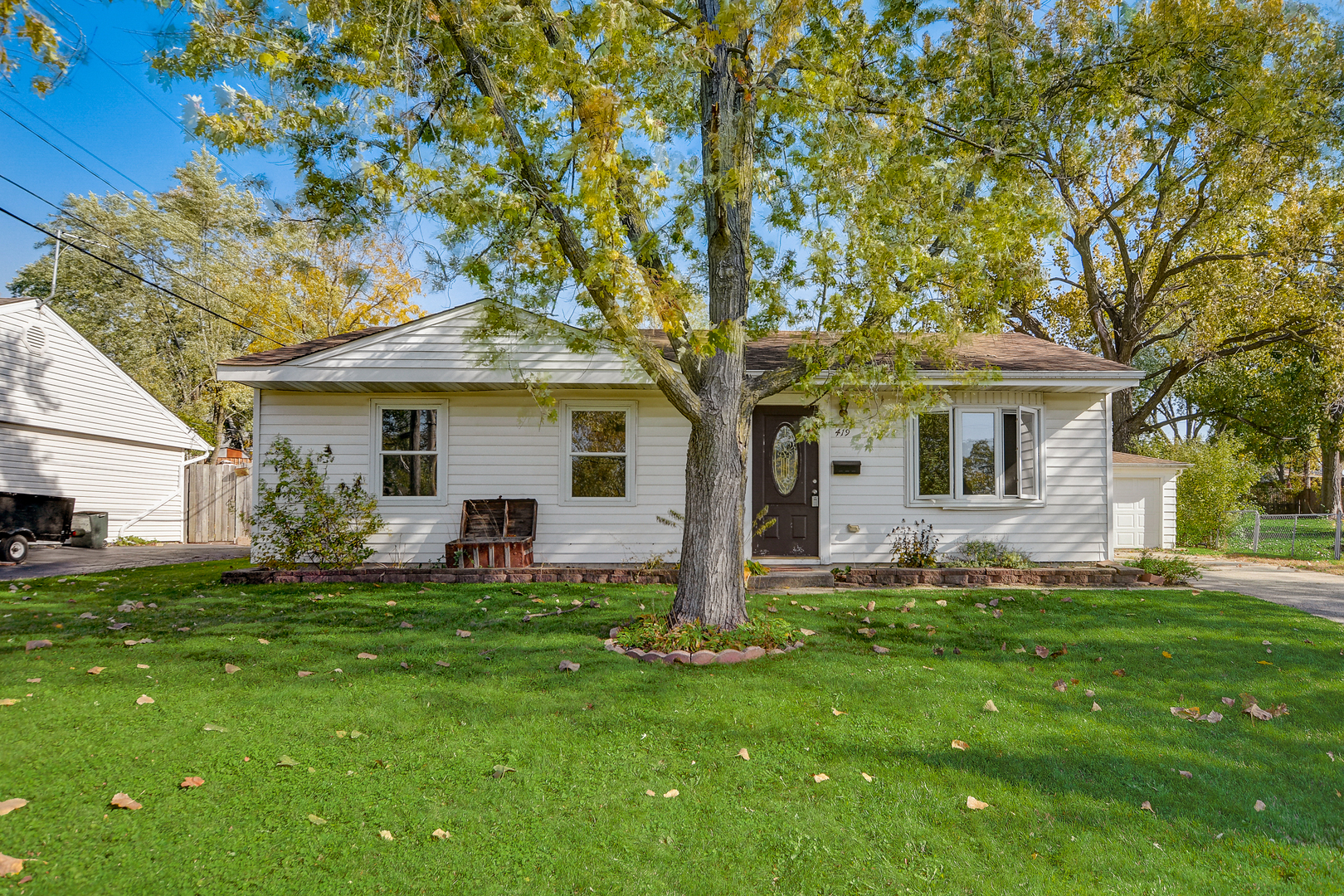 419 South Oltendorf Road Streamwood, IL 60107 - Photo 1 of 24 a front view of a house with a garden and yard