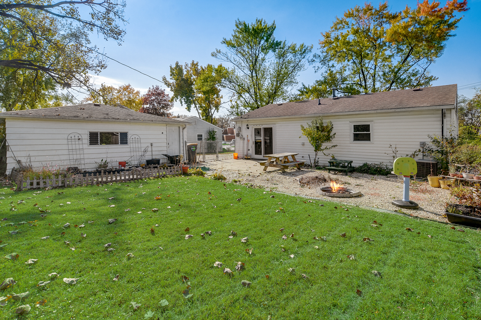 419 South Oltendorf Road Streamwood, IL 60107 - Photo 16 of 24 a backyard of a house with table and chairs