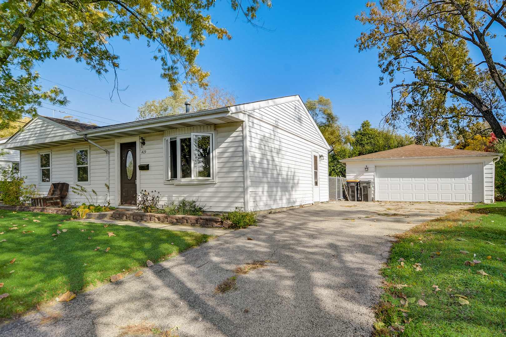 419 South Oltendorf Road Streamwood, IL 60107 - Photo 23 of 24 a front view of a house with a garden and yard