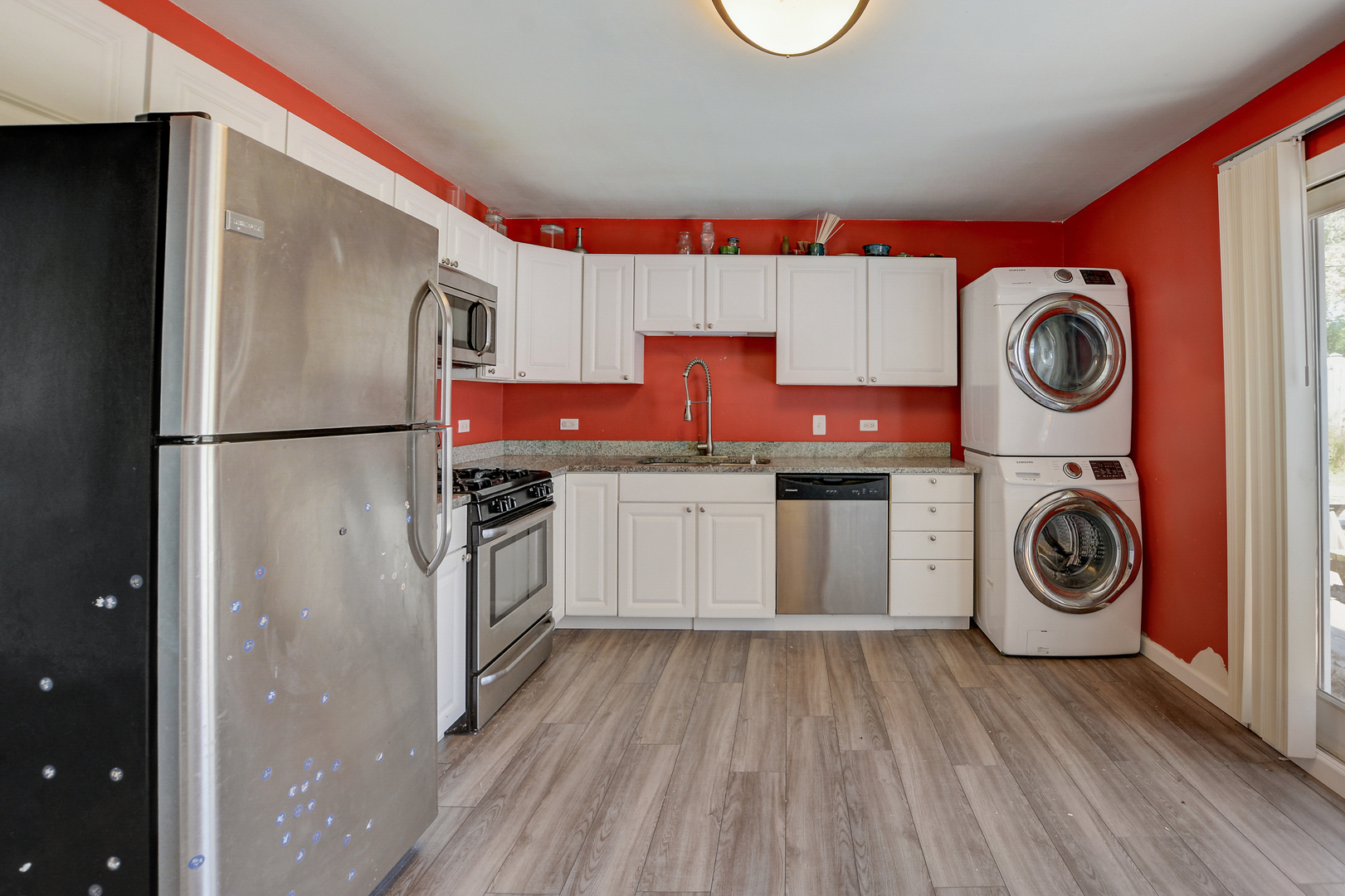 419 South Oltendorf Road Streamwood, IL 60107 - Photo 6 of 24 a kitchen with a refrigerator a stove top oven and cabinets