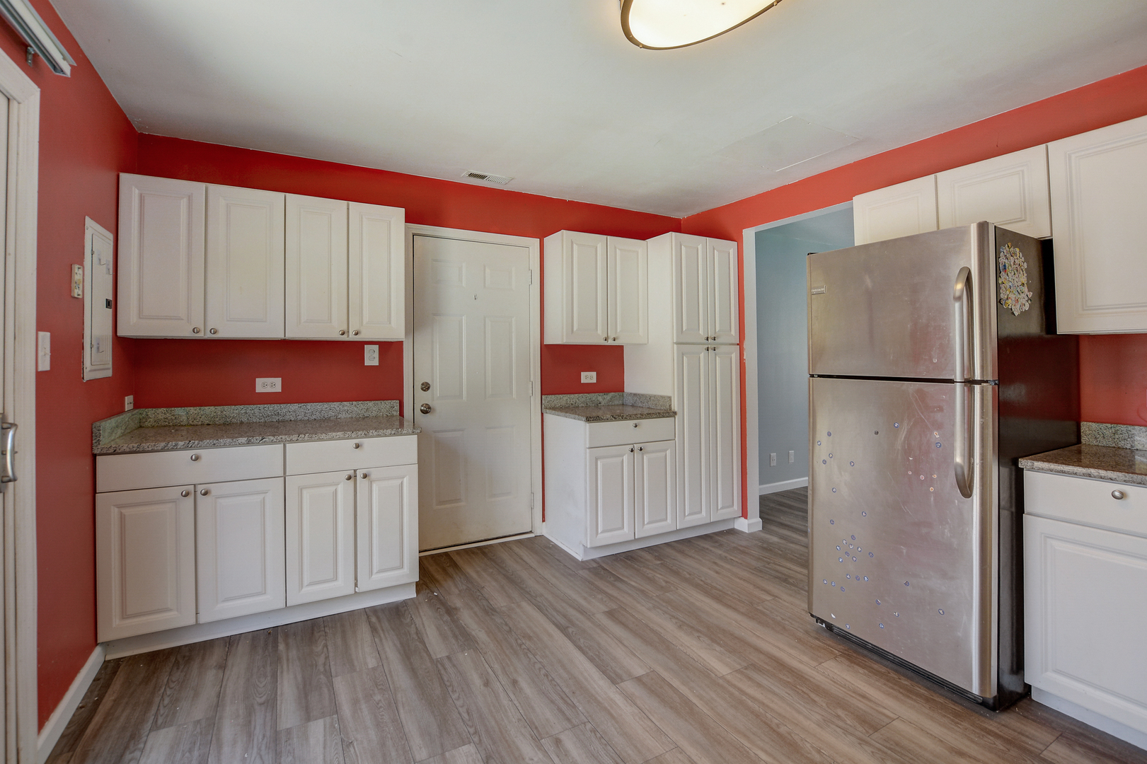 419 South Oltendorf Road Streamwood, IL 60107 - Photo 8 of 24 a kitchen with stainless steel appliances granite countertop a refrigerator and a stove top oven