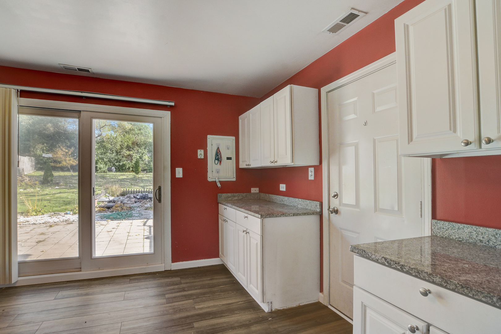419 South Oltendorf Road Streamwood, IL 60107 - Photo 9 of 24 a kitchen with stainless steel appliances granite countertop a stove a sink and a microwave