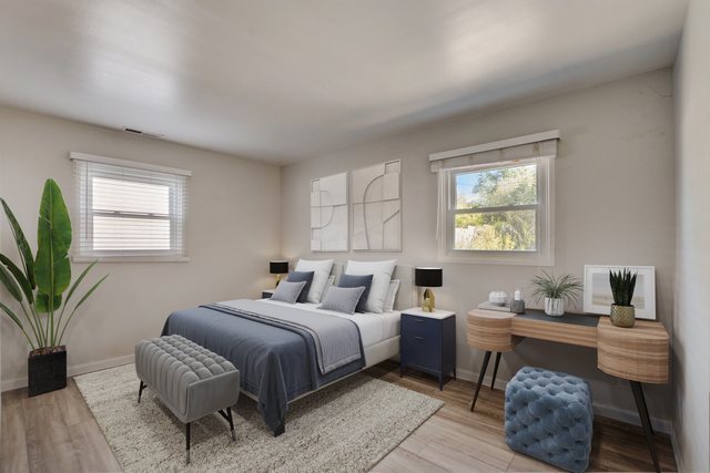419 South Oltendorf Road Streamwood, IL 60107 - Photo 10 of 24 a bedroom with a large bed and a window