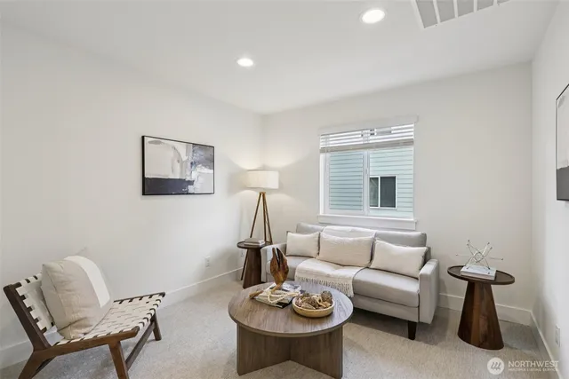 a spacious bedroom with a bed and a window