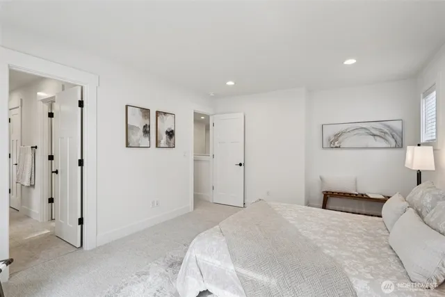 a bathroom with a sink mirror and vanity