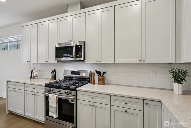 a dining room with a table and chairs