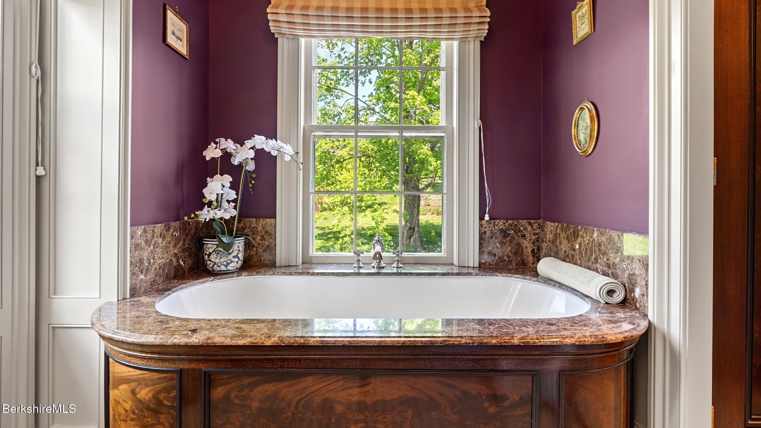 2650 Swamp Road Richmond, MA 01254 - Photo 24 of 49 a bath tub sitting in a bathroom next to a window